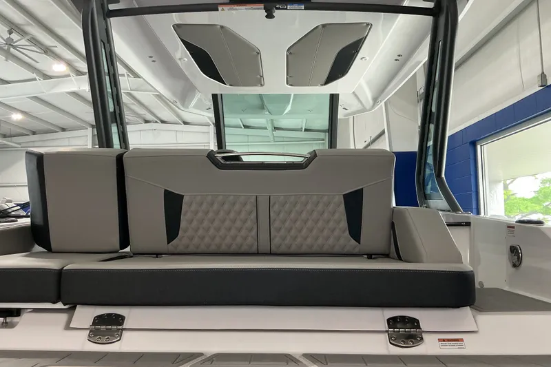 Slide: The Image of 2027 Monterey Elite 27 SD boat interior with modern seating and sleek design. - 7
