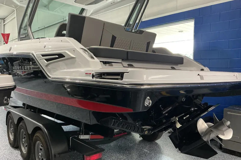 Slide: The Image of 2027 Monterey Elite 27 SD boat on trailer in showroom. - 3
