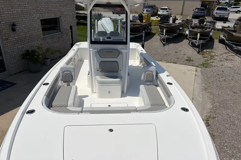 Slide: The Image of The image shows a 2026 Caymas 28 HB boat with a spacious deck and seating areas. - 8