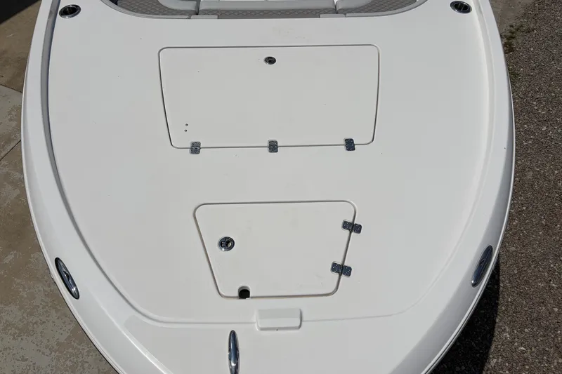 Slide: The Image of The image shows the foredeck of a Caymas 28 HB boat with two hatches. - 7