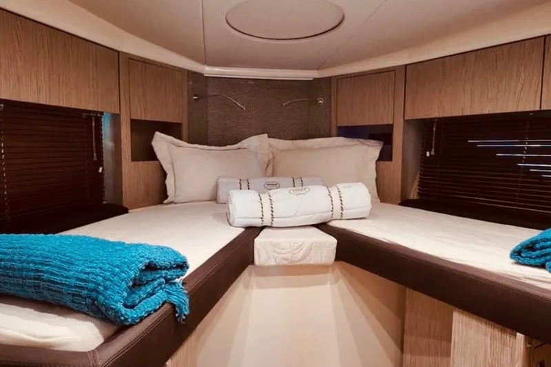 Slide: The Image of Luxurious cabin interior of 2024 Sessa Marine C44 Cruiser with cozy bedding. - 6