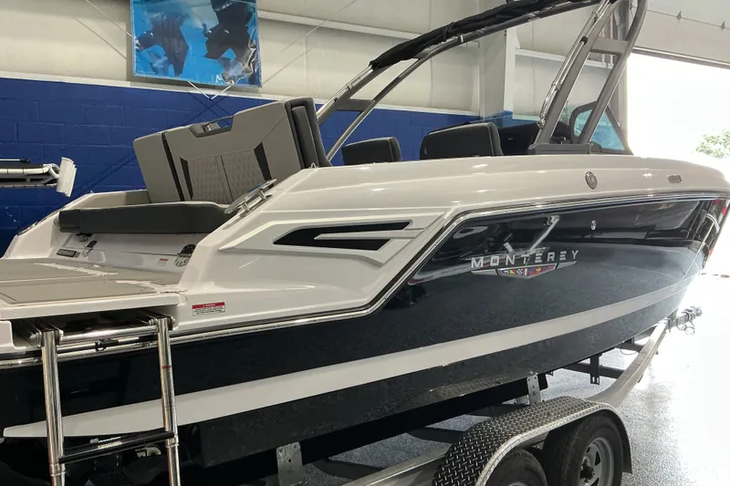 Slide: The Image of 2027 Monterey Elite 25 SD boat on trailer in showroom. - 4