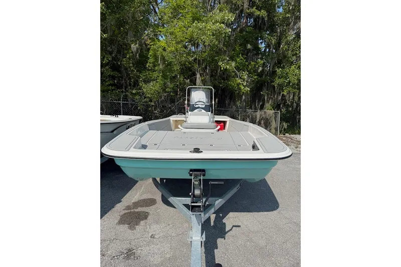 Slide: The Image of 2025 Mako Pro Skiff 17 CC boat on trailer, parked outdoors. - 11