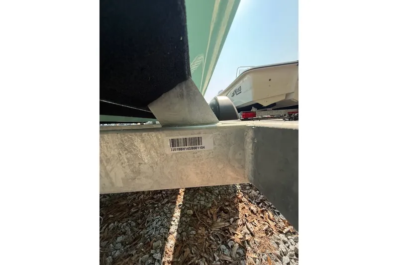 Slide: The Image of 2025 Mako Pro Skiff 17 CC trailer with visible barcode and hull detail. - 17