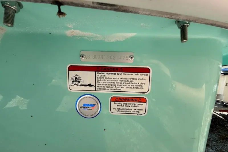 Slide: The Image of 2025 Mako Pro Skiff 17 CC with safety warnings and certification label. - 15