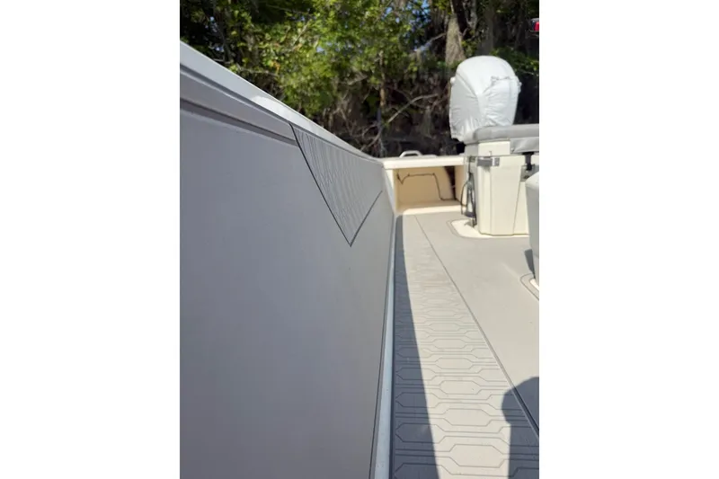 Slide: The Image of 2025 Mako Pro Skiff 17 CC interior view with textured flooring and seating. - 7