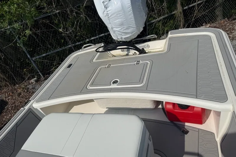 Slide: The Image of 2025 Mako Pro Skiff 17 CC boat interior with storage compartments and seating. - 6