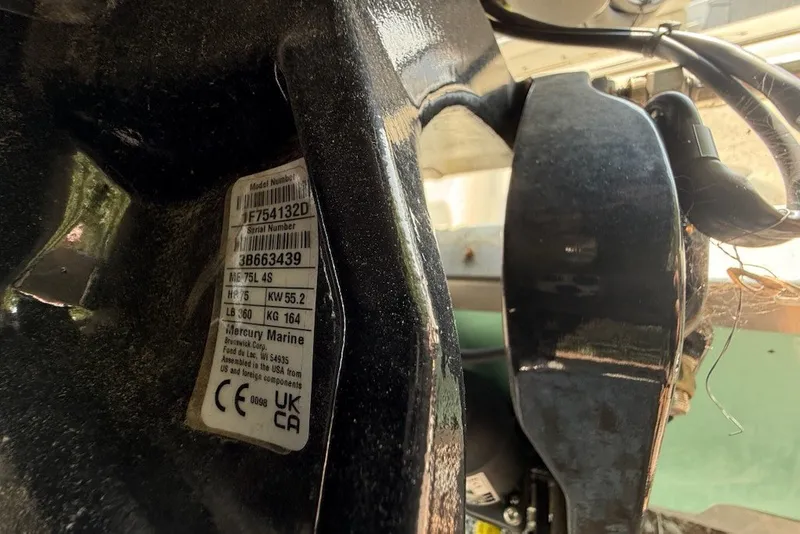 Slide: The Image of Close-up of Mercury Marine engine label on 2025 Mako Pro Skiff 17 CC boat. - 16