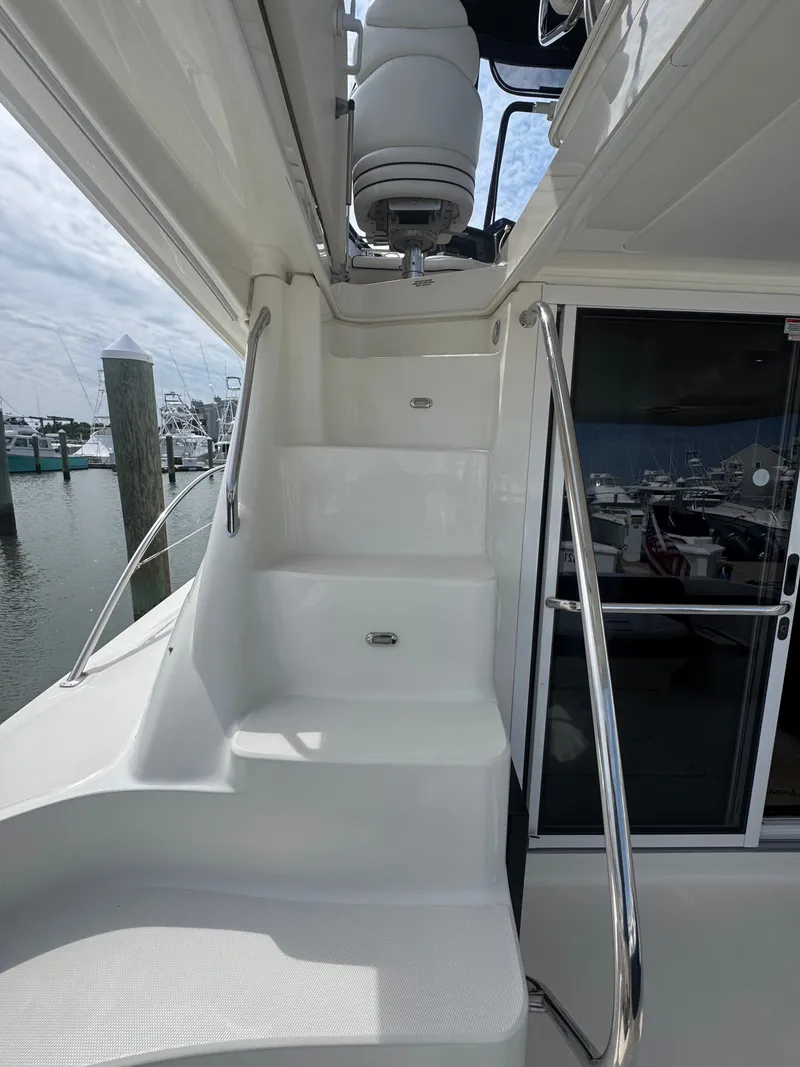 Slide: The Image of White stairs with stainless steel railings on a yacht, leading to an upper level. - 15