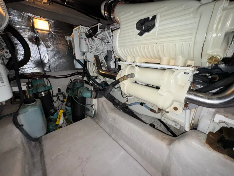 Slide: The Image of The engine room of a 2007 Sea Ray 44 Sedan Bridge showing engines and technical equipment. - 23