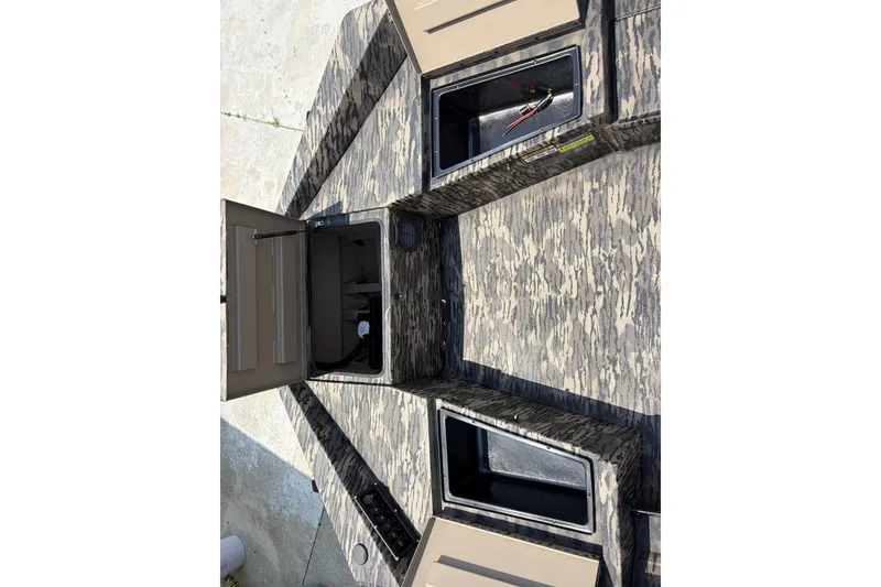 Slide: The Image of 2026 Havoc 1756 DBST boat interior with open storage compartments. - 9