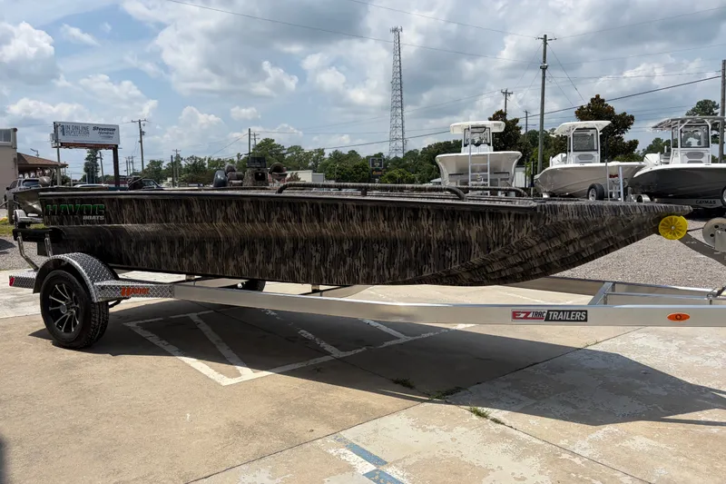 Slide: The Image of 2026 Havoc 1756 DBST boat on trailer, parked outdoors under cloudy sky. - 5