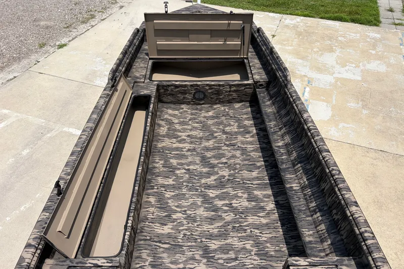 Slide: The Image of 2026 Havoc 1756 DBST boat interior with camouflage design and open storage compartments. - 11