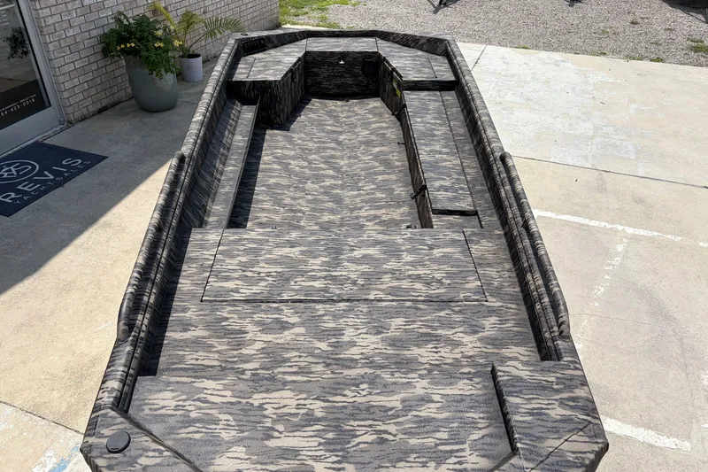 Slide: The Image of 2026 Havoc 1756 DBST boat with camouflage interior, parked outdoors. - 7