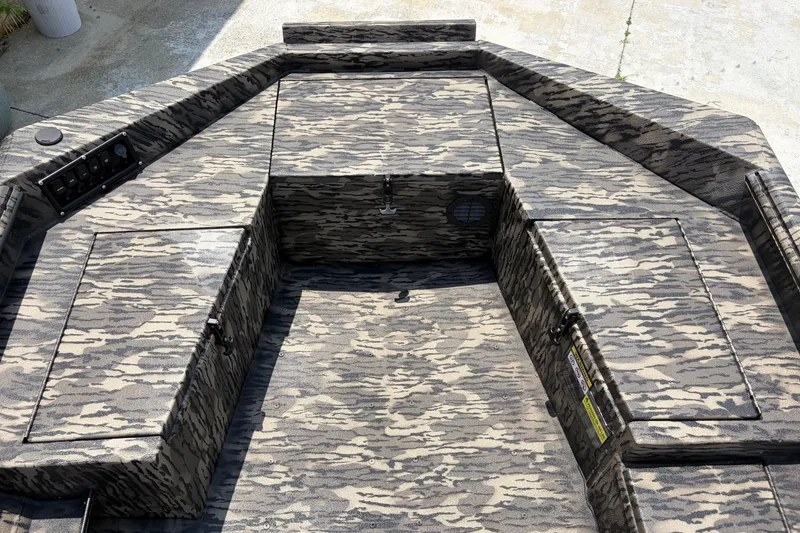 Slide: The Image of 2026 Havoc 1756 DBST boat interior with camouflage pattern and storage compartments. - 8