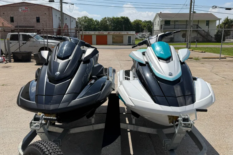 Slide: The Image of 2024 Yamaha Waverunner jet skis in black and white, parked on a trailer. - 7
