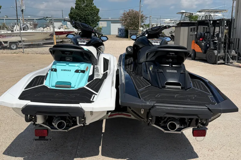 Slide: The Image of 2024 Yamaha Waverunner jet skis in white and black, parked on a trailer. - 3