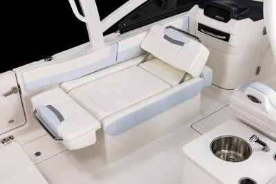 Slide: The Image of 2026 Robalo R257 Dual Console interior with comfortable seating and modern amenities. - 7