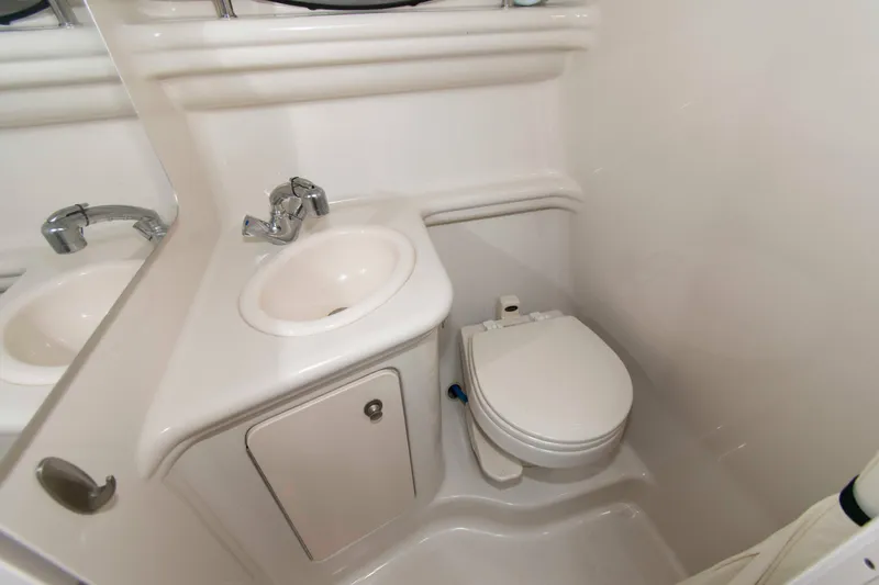 Slide: The Image of 2007 Sea Ray 270 Amberjack boat bathroom with sink and toilet. - 12