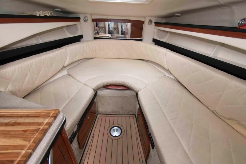 Slide: The Image of Luxurious interior cabin of 2007 Sea Ray 270 Amberjack boat with plush seating. - 11
