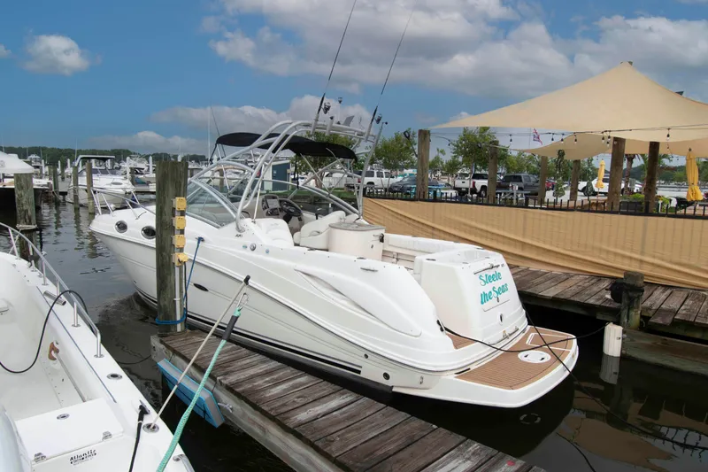 The Image of 2007 Sea Ray 270 Amberjack docked at marina under blue sky. - 0