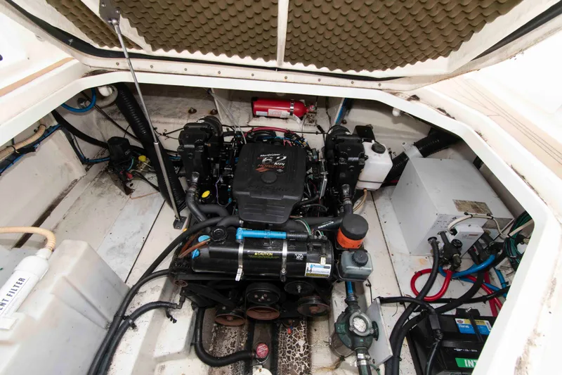 Slide: The Image of Engine compartment of a 2007 Sea Ray 270 Amberjack boat, showcasing mechanical components. - 13