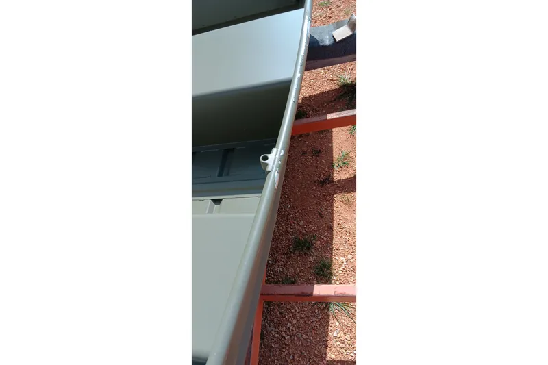 Slide: The Image of 2026 Tracker Grizzly 10 Jon boat on a trailer, viewed from above. - 8
