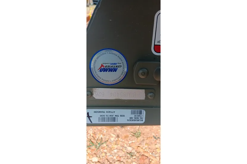 Slide: The Image of Sticker and label on 2026 Tracker Grizzly 10 Jon boat, showing certification and model details. - 11