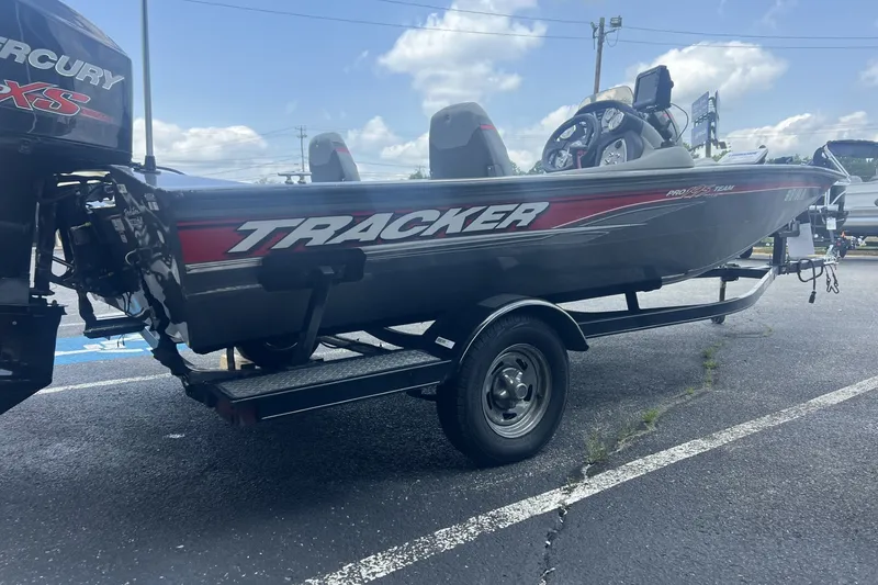 Slide: The Image of 2016 Tracker Pro Team 195 TXW boat on trailer, featuring Mercury engine. - 6
