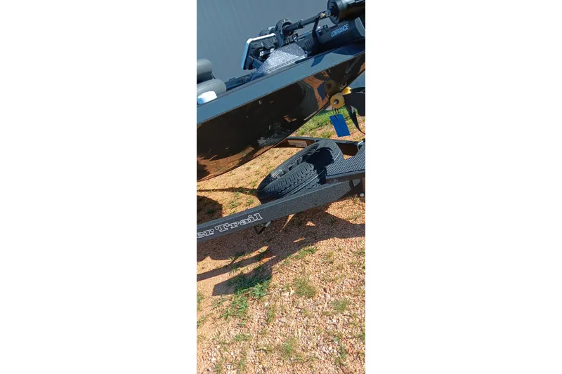 Slide: The Image of 2026 Ranger RT198P boat trailer on gravel, featuring Lowrance equipment. - 7