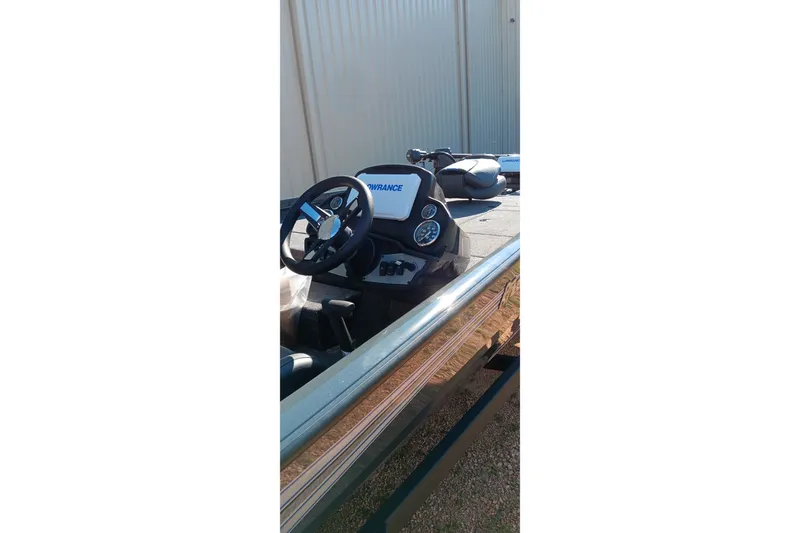 Slide: The Image of 2026 Ranger RT198P boat dashboard with steering wheel and control panel. - 5