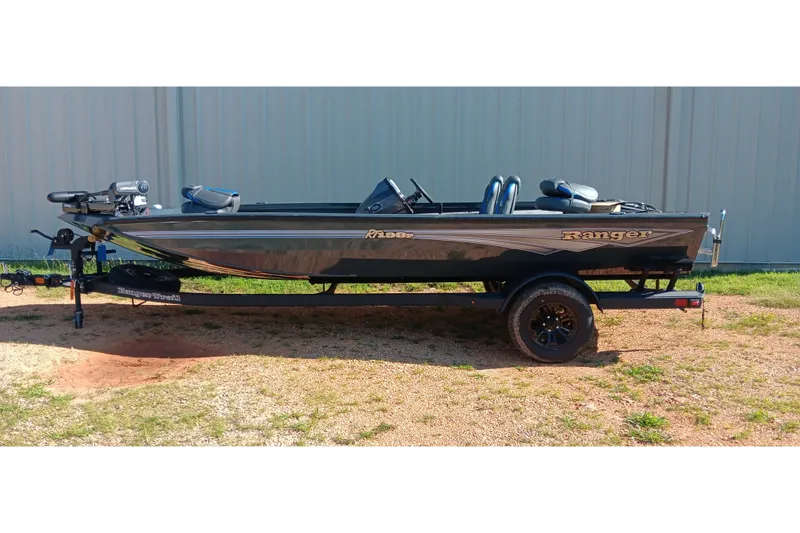 The Image of 2026 Ranger RT198P fishing boat on trailer, parked outdoors. - 0
