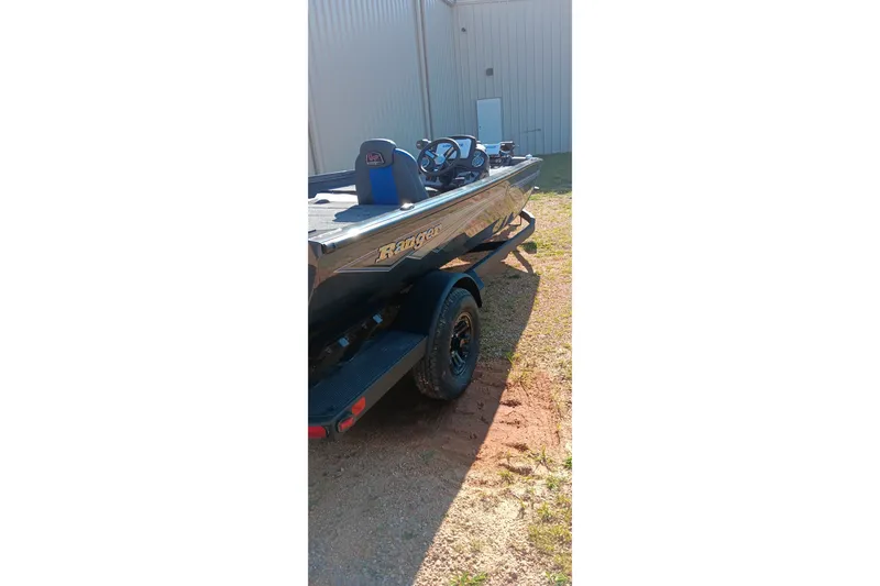 Slide: The Image of 2026 Ranger RT198P boat parked outdoors, showcasing sleek design and modern features. - 4