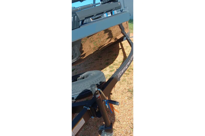 Slide: The Image of 2026 Ranger RT198P boat trailer on gravel, showcasing sturdy construction and design. - 8