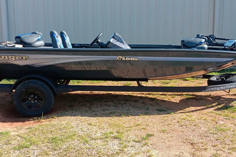 Slide: The Image of 2026 Ranger RT198P fishing boat on trailer, parked outdoors. - 1