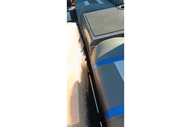 Slide: The Image of Interior of 2026 Ranger RT198P boat with blue-accented seating and storage compartment. - 18