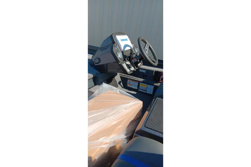 Slide: The Image of 2026 Ranger RT198P boat cockpit with steering wheel and controls. - 19
