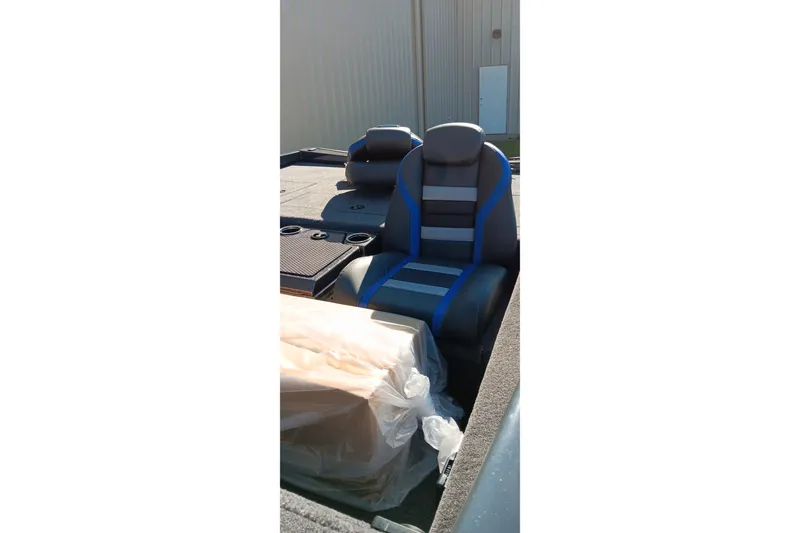 Slide: The Image of 2026 Ranger RT198P boat interior with blue and gray seating. - 15