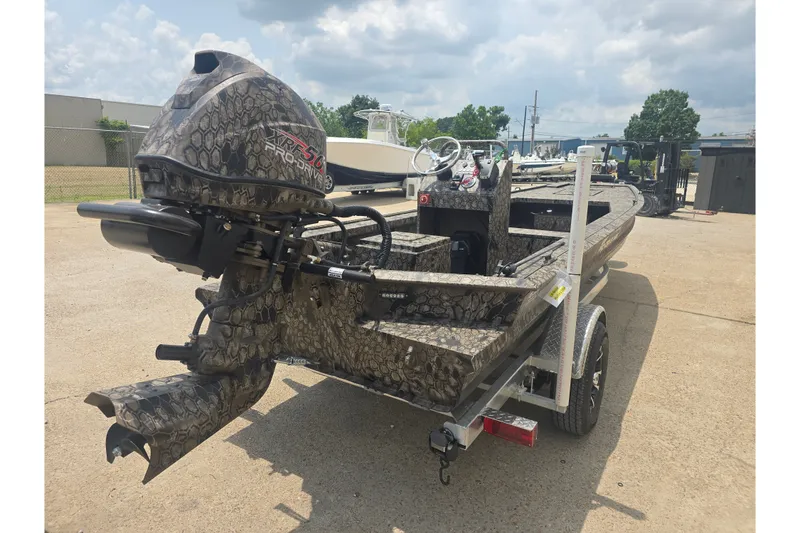 Slide: The Image of 2026 Pro Drive 2054 X Series TD CC boat with camouflage design on a trailer. - 4
