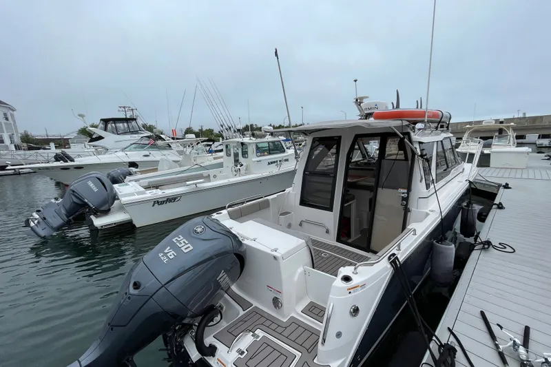 Slide: The Image of 2024 Cutwater C-248 Coupe docked, featuring Yamaha 250 V6 outboard engine. - 4