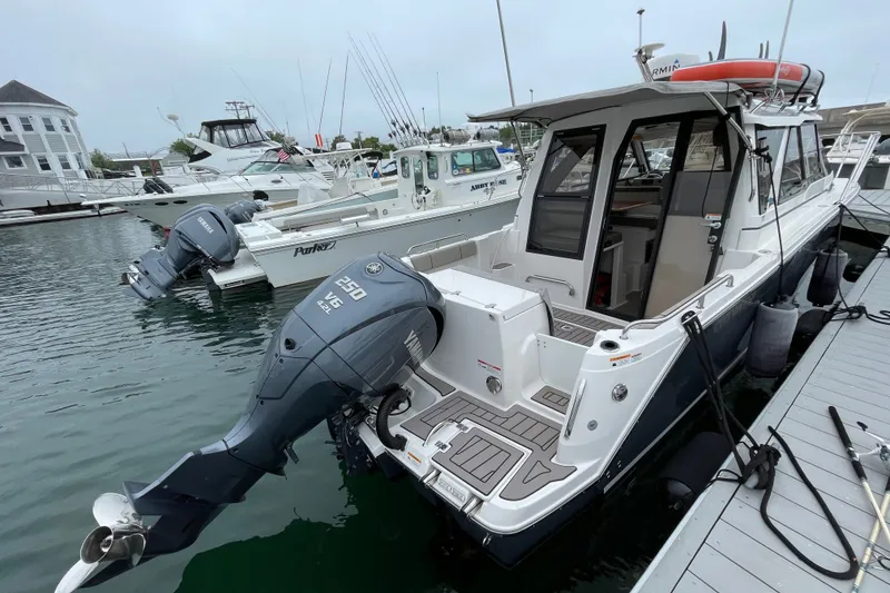 Slide: The Image of 2024 Cutwater C-248 Coupe docked with Yamaha outboard engine. - 3