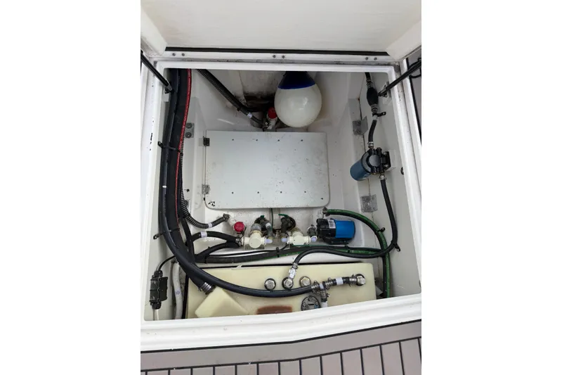 Slide: The Image of 2024 Cutwater C-248 Coupe engine compartment with hoses and mechanical components. - 30