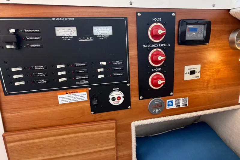 Slide: The Image of Electrical control panel of 2024 Cutwater C-248 Coupe boat, featuring switches and gauges. - 27