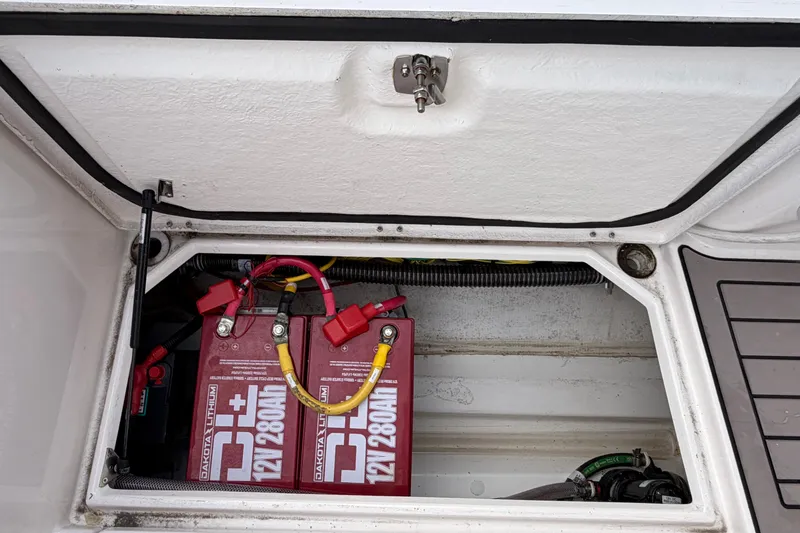 Slide: The Image of Battery compartment of 2024 Cutwater C-248 Coupe, featuring Dakota Lithium 12V batteries. - 31