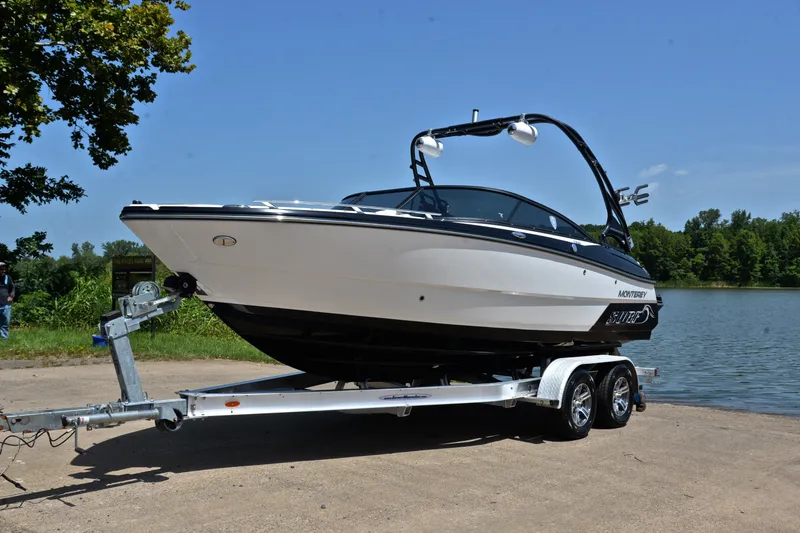 Slide: The Image of 2020 Monterey 218 Surf boat on trailer by a lake, ready for launch. - 10