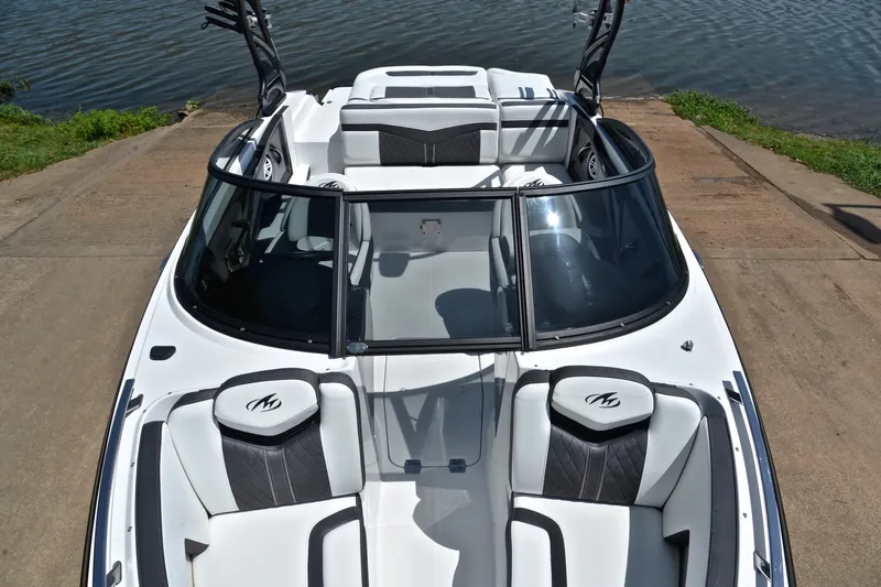 Slide: The Image of 2020 Monterey 218 Surf boat on a ramp, featuring sleek design and comfortable seating. - 20