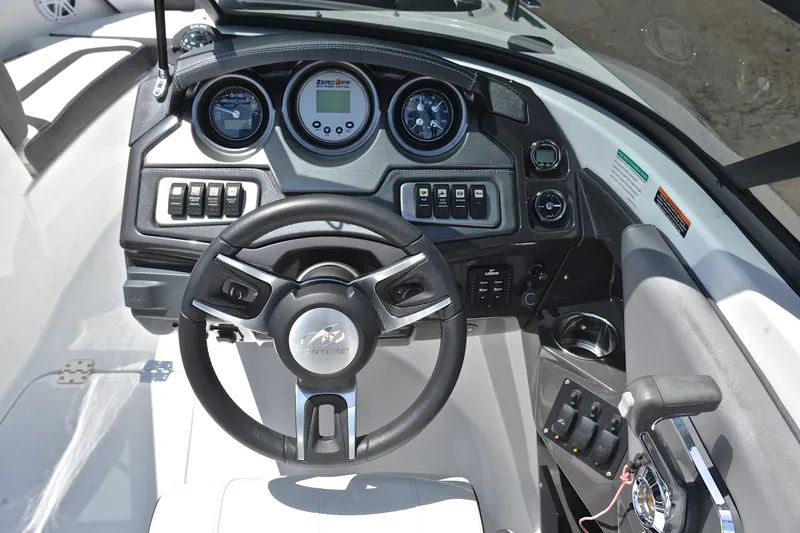 Slide: The Image of Cockpit view of 2020 Monterey 218 Surf boat with steering wheel and control panel. - 26