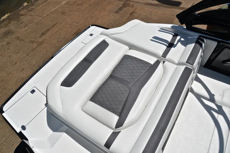 Slide: The Image of 2020 Monterey 218 Surf boat with white and gray cushioned seating. - 23