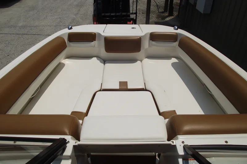 Slide: The Image of 2020 Bayliner DX 2000 boat interior with brown and white seating. - 4