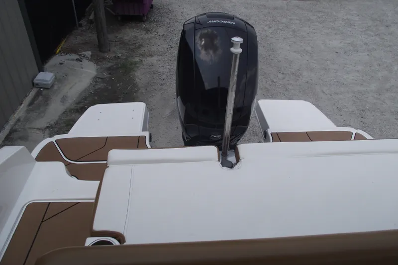 Slide: The Image of Bayliner DX 2000 boat rear view with Mercury outboard motor, 2020 model. - 5